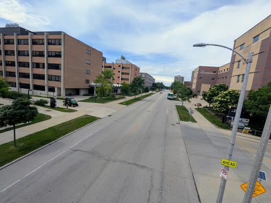 A two-lane road with buildings on either side of it