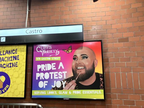 Castro
Cliffs
VARIETY
479 CASTRO STREET
PRIDE A
PROTEST
OF JOY
SERVING LOOKS, GLAM & PRIDE ESSENTIALS.
OUTFRONT/

A picture of A bearded white man with eyeshadow and applying lip gloss