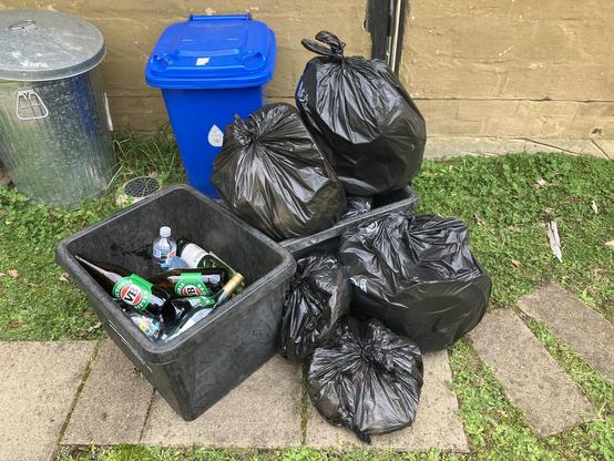 A large pile of bagged trash from a group that was in the guest cottage not much more than 36 hours.