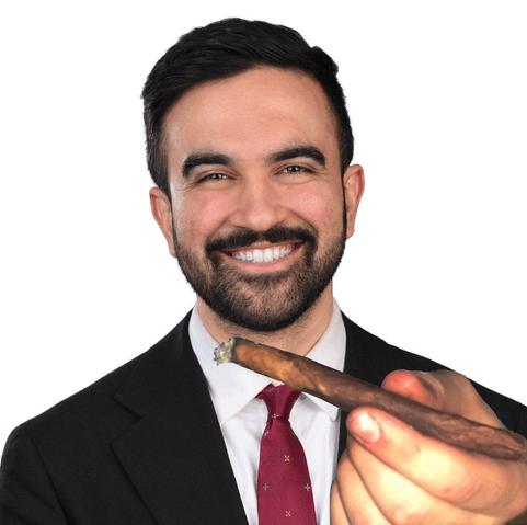 A picture of the WINNER OF THE DEMOCRACTIC PRIMARY ZOHRAN MAMDANI with a photoshopped hand offering you a BLUNT BAYBEEEE.