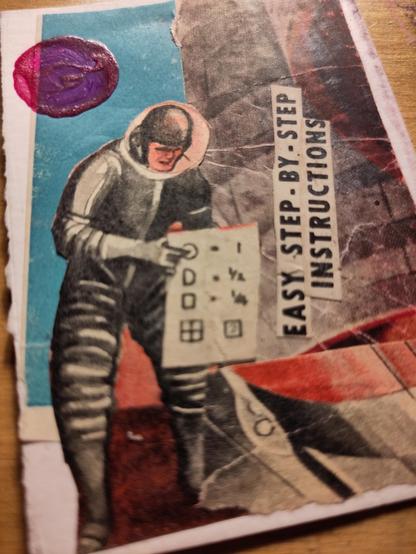 Mixed media collage - spaceman looking at large instruction sheet under a magenta planet in the sky