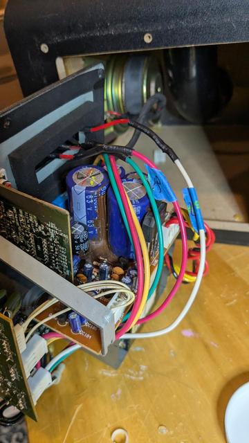Soldered wires attaching a new speaker terminal to the speaker system