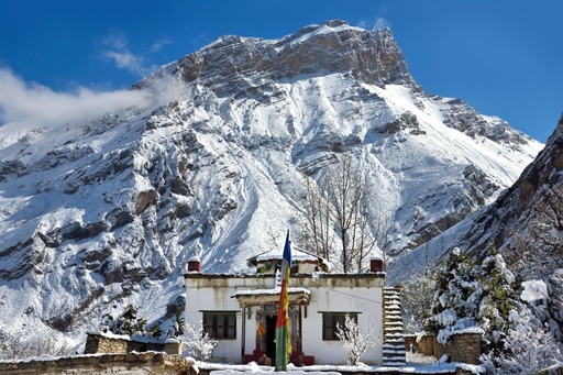 Muktinath Temple surrounded by snow-capped Himalayan peaks in Nepal.