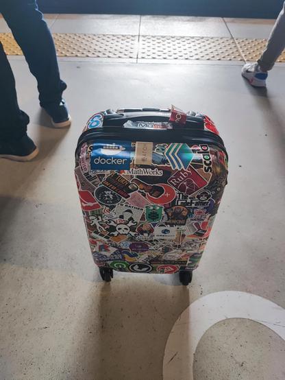 My suitcase full of it-related stickers.