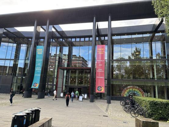 Image of entrance to large hall. ISEE banners flank it.