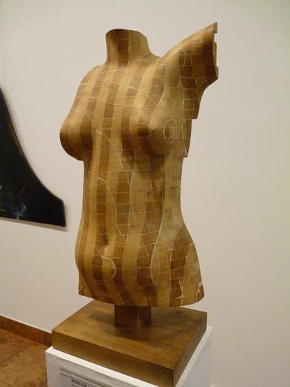torso, sculpted from wooden cubes, of contrasting colour,  cemented together, emphasising form & shapeliness