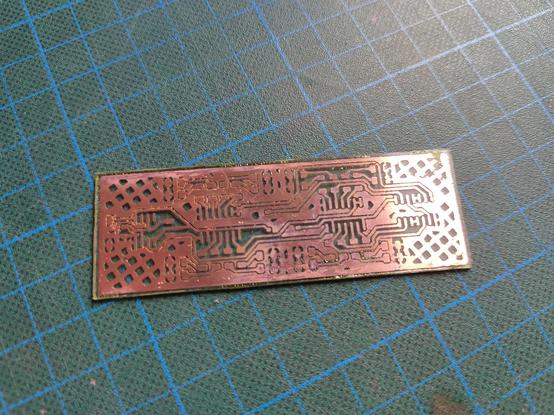The etched PCB. There are lots of bridges in narrow areas.