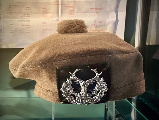 Khaki balmoral bonnet with a silver hat badge