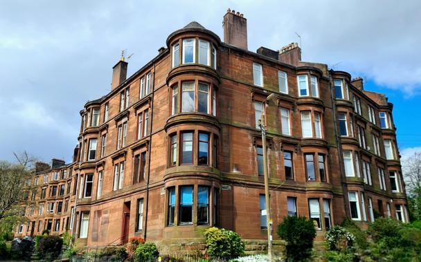 Red sandstone Glasgow tenements.