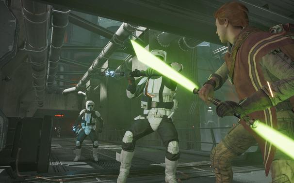 A screenshot of Star Wars Jedi: Fallen Order, depicting Cal Kestis fighting a Scout Trooper fielding a baton, with another in the background ready to provide backup.