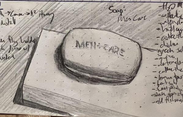 A pencil sketch of a bar of soap inscribed with the text "MEN CARE." The text is starting to wear away with use.