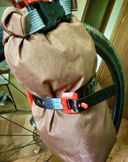 The TPU strap (black) holding the stuff sack I sewed, there’s a PETG (red) clasp for securing the strap