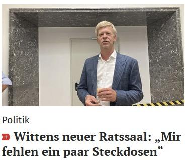 Foto des Wittener Bürgermeisters, darunter steht der Satz: Wittens neuer Raatssaal: "Mir fehlen ein paar Steckdosen"