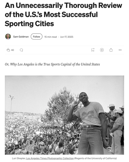 Screenshot of a story by Sam Goldman with title “An Unnecessarily Thorough Review of the U.S.’s Most Successful Sporting Cities” and a black-and-white photo of Magic Johnson, wearing a Lakers 1985 World Champions T-shirt, listening to a large crowd outdoors