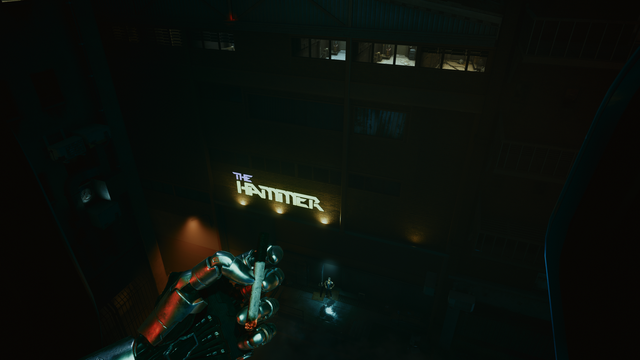 POV of a person with a silver mechanical hand throwing a smoke from a helicopter below to a place called THE HAMMER. There is a person standing in the direction of the throw