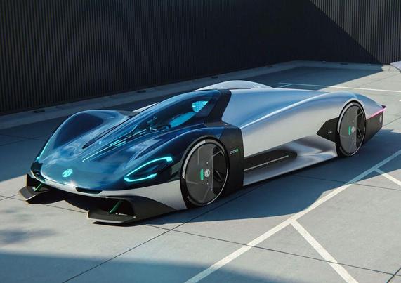 Futuristic silver and black sports car with sleek design and blue accents, parked on a modern pavement.