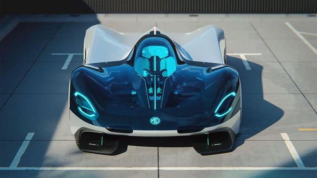 A futuristic, sleek race car with a large glass canopy and vibrant blue accents, parked in an empty lot under natural light.