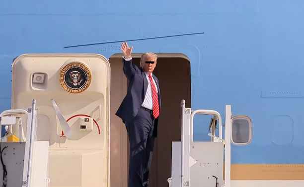 Trump on the airplane stairs of the Airforce One on Schiphol (Amsterdam Airport). With a small black stripe of his eyes, to show who he truly is. A criminal genocidal fascist rapist!