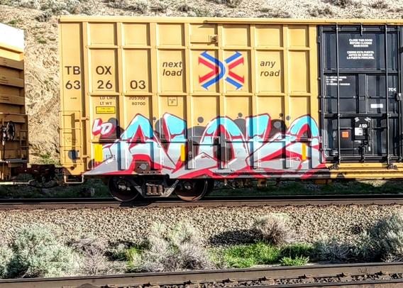 Train car with graffiti rolling through Kamloops BC Canada
