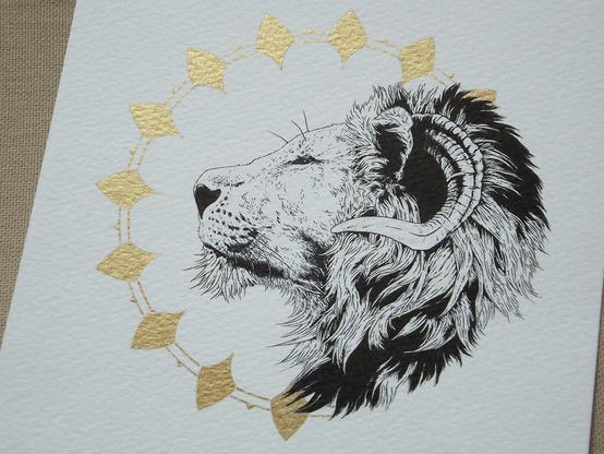 pen drawing, the side portrait of a lion with horns, in a gold ornate circle.