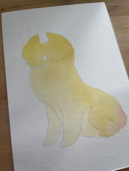picture of the start of a painting of a little orange monster, just the first wash of yellow.