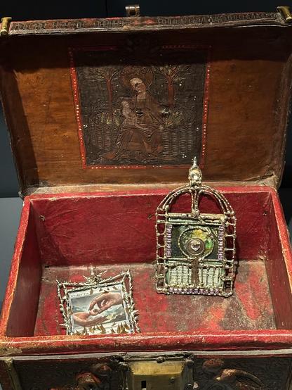 Two jewel encrusted magic cards in a medieval box