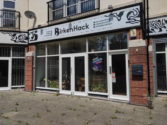 the front entrance of Birkenhack adorned with a why2025 banner