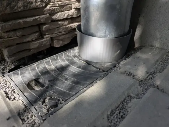 3d printed funnel between the rain spout pipe and the rest of the drain underground