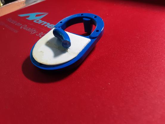 Appendino blu con la protuberanza esterna spezzata come detto
