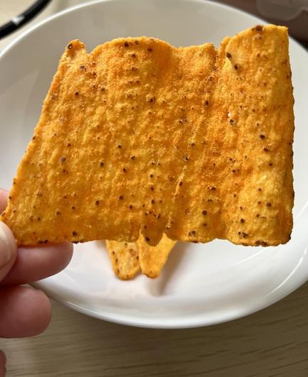 Aldi knock-off Doritos, stuck together to form a triangle strip.