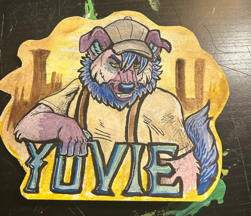 Watercolor painting of an anthro canine/hyena hybrid. He looks grumpy. He is wearing a stained t-shirt , suspenders, and a newsboy cap. Nehind him are smoke stacks. It says "Yuvie" on the bottom