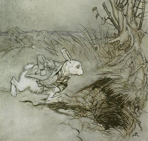 The White Rabbit leaps down his hole. An illustration by Arthur Rackham for "Alice in Wonderland."