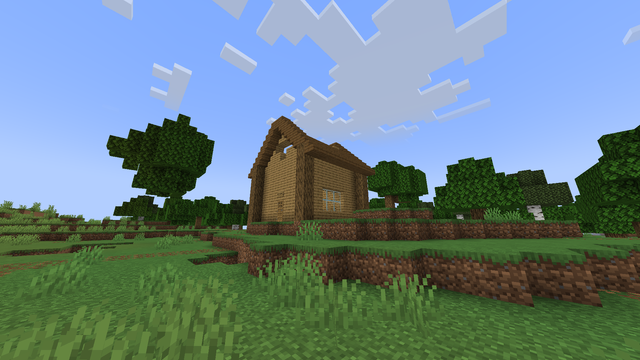 Screenshot from Minecraft showing a wooden house with a pitched, unfinished roof. The structure sits on grassy terrain, surrounded by trees, under a blue sky with scattered clouds.