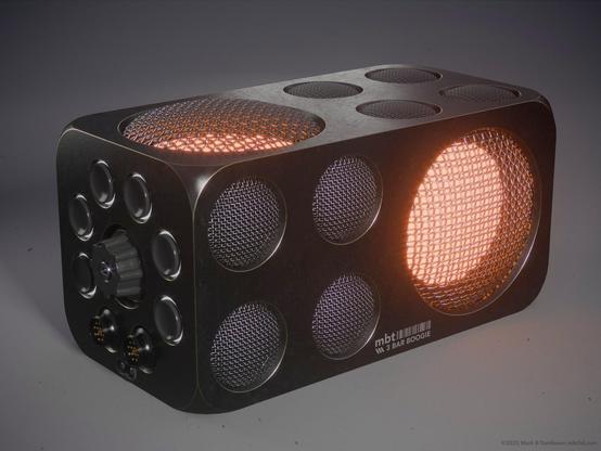 Rectangular box with round inserts covered in grills and a bright lit area in the larger ones.
Buttons connectors and a knob on the end.