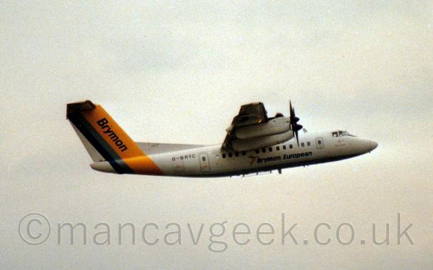 Side view of a high-winged, 4 propellor-engined airliner flying from left to right at a low altitude, with flaps extended from the rear of the wings, the undercarriage already tucked away, and the nose raised sharply, suggesting it has just taken off.
The plane is mostly white, with a yellow and blue band wrapped around the rear fuselage and tail, with large, blue "Brymon" titles on the yellow part of the tail, blue "Brymon European" titles on the lower mid fuselage, and the black registration "G-BRYC" on the upper rear fuselage.
Cloudy grey sky fills the rest of the frame.