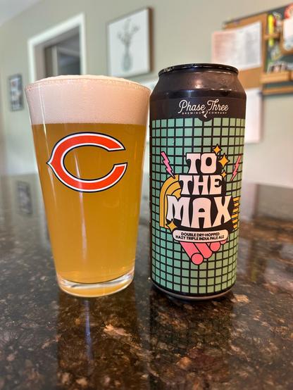 A Chicago bears glass full of beer with a phase three can of beer next to it called “to the max”