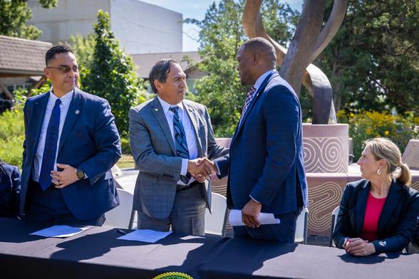 Muscogee (Creek) Nation Principal Chief David Hill shakes City of Tulsa Mayor Monroe Nichol’s hand after signing a settlement agreement in Muscogee (Creek) Nation v. City of Tulsa. (Courtesy: MCN Communications)