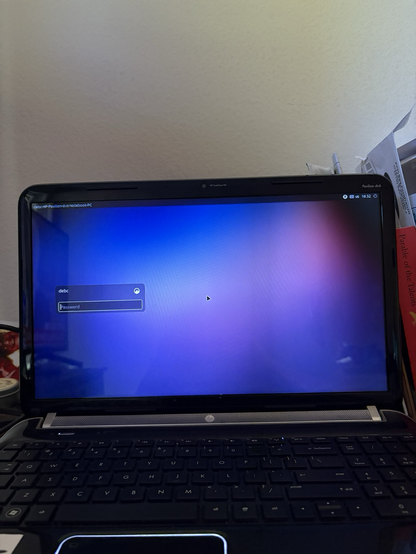 an old laptop with a custom purple screen.
