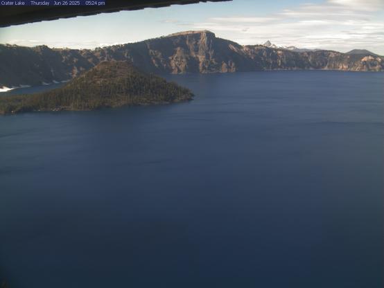 Is Crater Lake visible today? Sometimes the lake is hidden by clouds, especially in the winter. This view looks north across the lake from the Sinnott Overlook at Rim Village (elevation 7,100 feet). On a clear day, it takes in Wizard Island, Llao Rock, and Mount Thielsen. Image updates every 4 to 6 minutes.