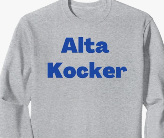 The Yiddish saying Alta Kocker is shown in blue lettering on a sweatshirt.