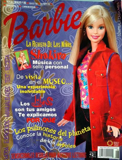 Portada de la revista Barbie con una muñeca Barbie de cabello rubio y atuendo colorido, destacando a Shakira en la portada.