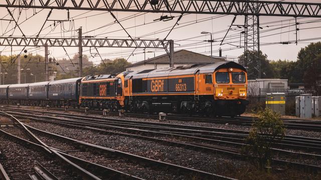GBRf Class 66, 66313, hauling Class 99, 99001, into Carlisle station, with some trailing Mk.2 coaches