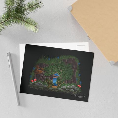 A postcard with a fine art print depicting a faerie house -- a tiny dwelling in an old treestump, surrounded by tiny wildflowers and shrubberies.