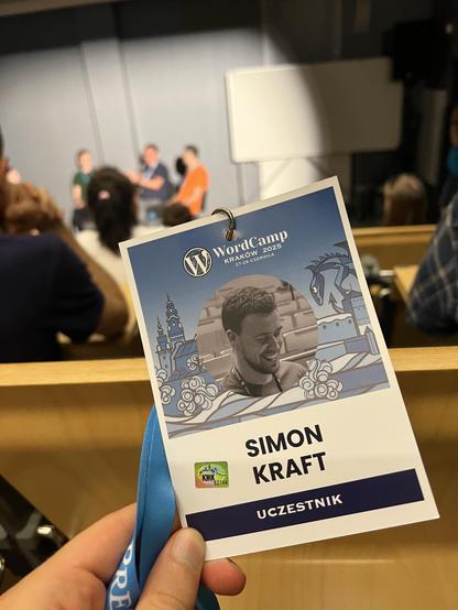 A WordCamp badge with the Name Simon Kraft on it