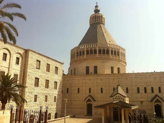 This image appears to show a religious building, likely with significant architectural features such as a dome and stone walls. The presence of palm trees suggests a warm climate, which is common in regions with historical and religious significance. The style of the building indicates it may be of a specific cultural or historical background. If you have specific questions about the building or its significance, feel free to ask!

Image Credits: Wikimedia / FLASHPACKER TRAVELGUIDE / CC BY-SA 2.0