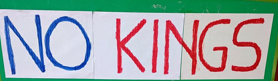 Closeup of NO KINGS protest sign