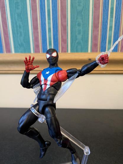 Marvel Legends Miles Morales Boricua Suit in a swinging pose similar to the Amazing Fantasy cover. He is waving at the viewer