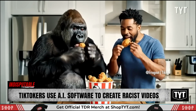 A gorilla and a young black man share a bucket of KFC.