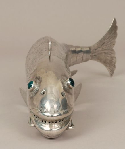 official museum photo, front profile view, showing green glass eyes and smiling face