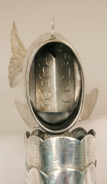 official museum photo, “hinged head lifts to reveal the Ten Commandments designated by Hebrew letters”